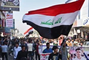 متظاهرو العراق لا يخشون كورونا ويعدون أن السياسيين هم “الفيروس الحقيقي”
