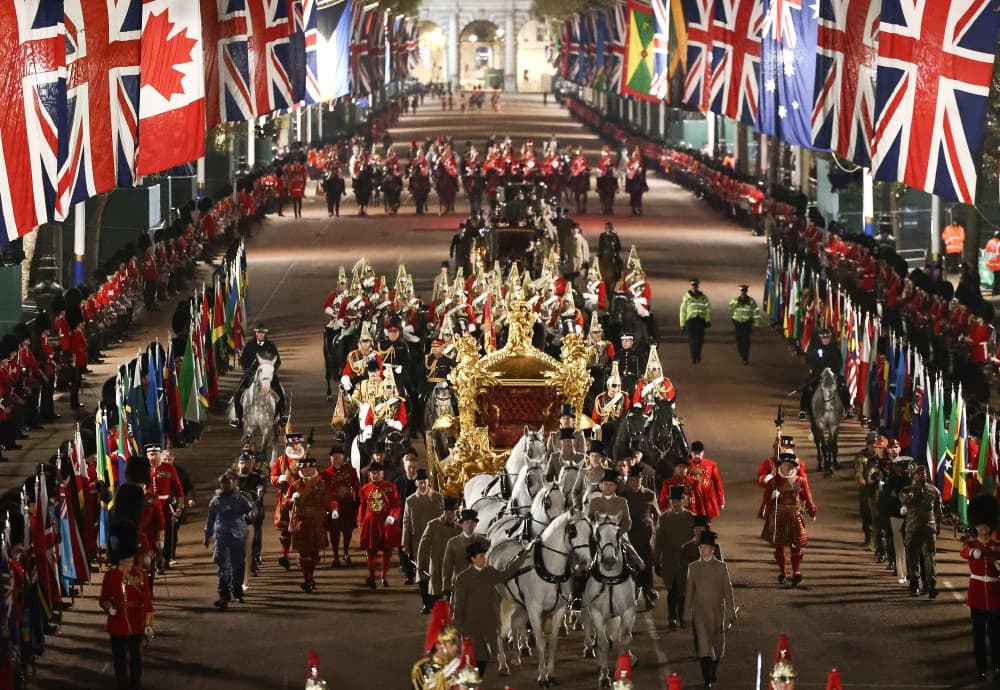 Members of the military take part in a full overnight dress rehearsal of the Coronation Ceremony of Britain’s King Charles and Camilla, Queen Consort in London