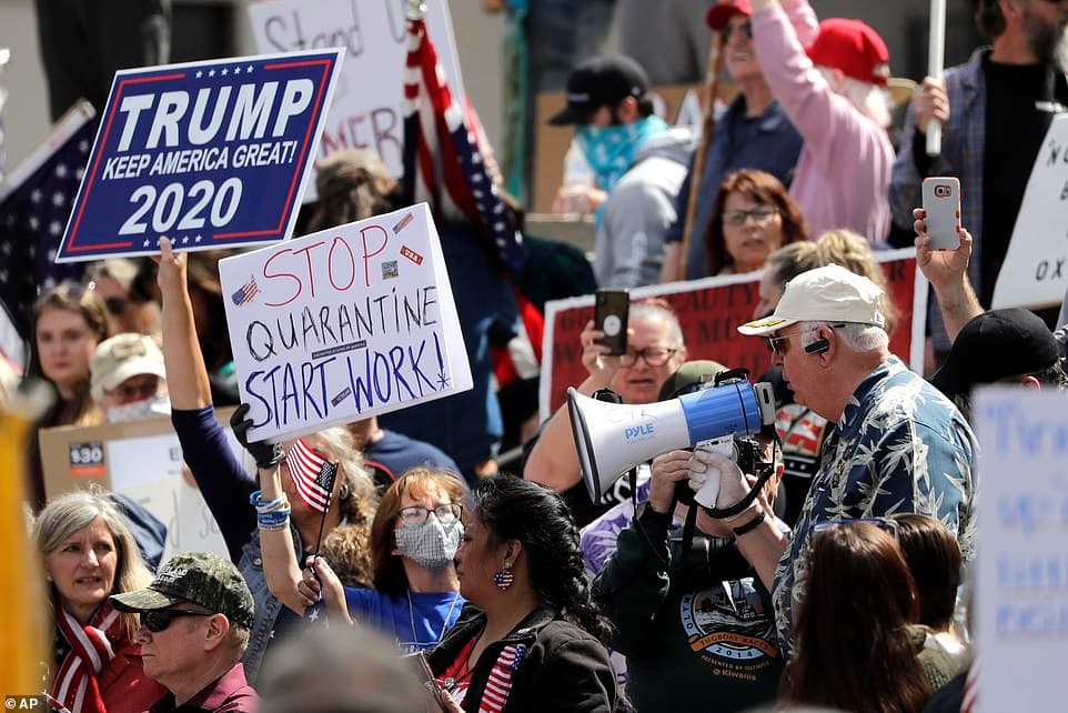 27398108-8235127-Demonstrators_crowd_together_at_a_protest_opposing_Washington_st-a-7_1587351541496