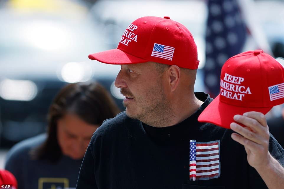 27398160-8235127-Many_protesters_wore_hats_and_t_shirts_in_support_of_President_T-a-1_1587351541128