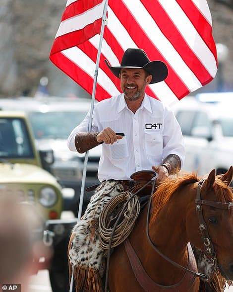 27398162-8235127-A_proteset_rides_his_horse_to_join_in_a_car_protest_against_the_-a-169_158734694367