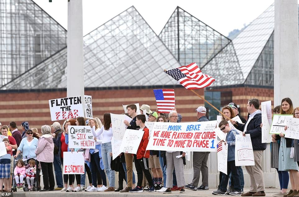 27398176-8235127-Flatten_the_Fear_Waving_flags_and_holding_signs_Freedom_Rally_pa-a-9_1587351542520