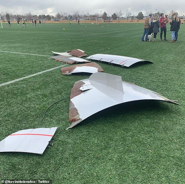 39559022-9283741-Pieces_of_the_aircraft_landed_on_a_football_field_as_seen_in_the-a-3_1613921173982